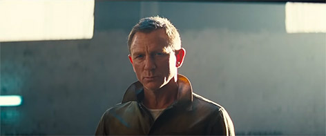 Daniel Craig No Time To Die collar jacket garage open door