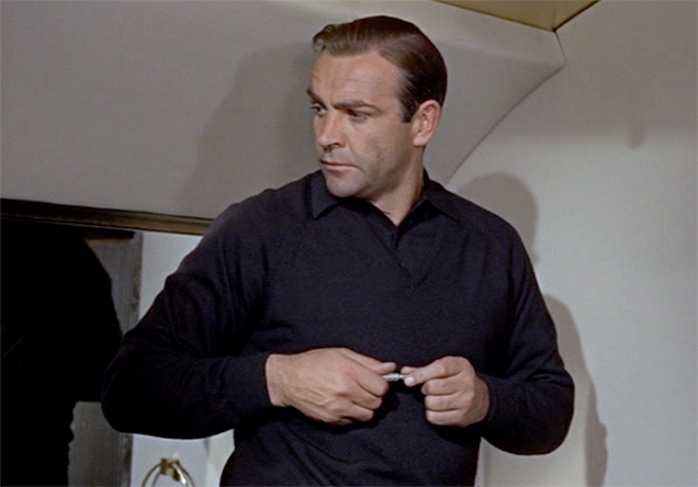 Sean Connery as James Bond holding the Gillette Slim Razor in Goldfinger's jet.