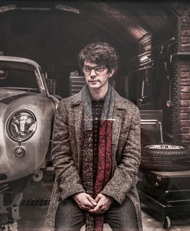 Q (Ben Whishaw) wearing the Billy Reid Astor Coat in a promotional image for SPECTRE