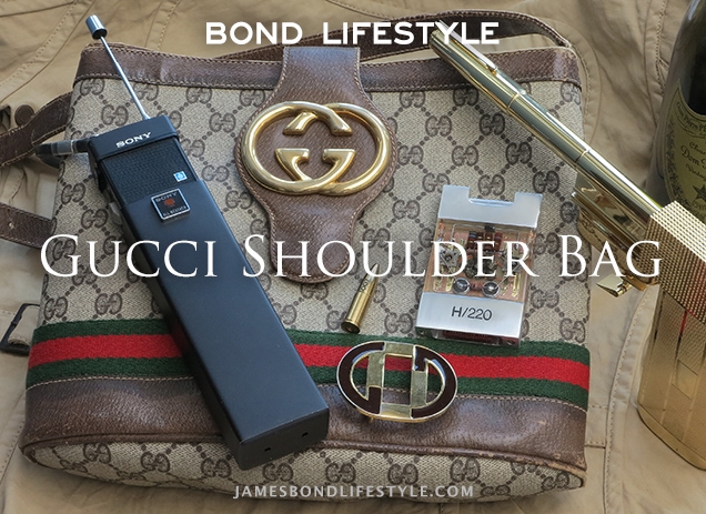 Vintage Gucci Bag, similar to the one used in The Man With The Golden Gun, and other items seen in the film: a Sony walkie talkie, Gucci belt buckle, Solex Agitator, Golden Gun, Dom Pérignon Champagne.