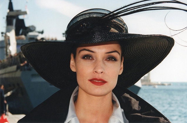 Xenia Onatopp (Famke Janssen) wears a black hat created by Philip Somerville in the movie GoldenEye.