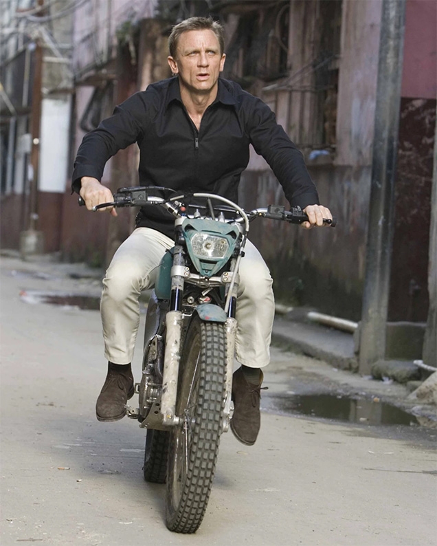 Daniel Craig as James Bond wears Church Ryder III chukka boots in Quantum of Solace.