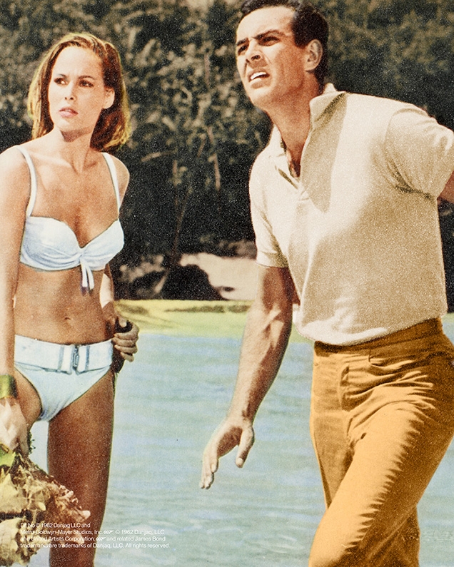 A heavily color-corrected promotional image from Dr No shows an ivory shirt, while the shirt and trousers in the film are blue
