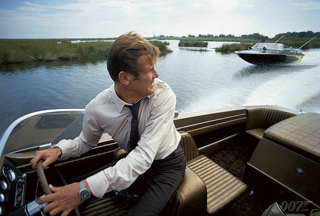 Roger Moore as James Bond wears a Tissot PR-516 watch in Live And Let Die during the speedboat chase