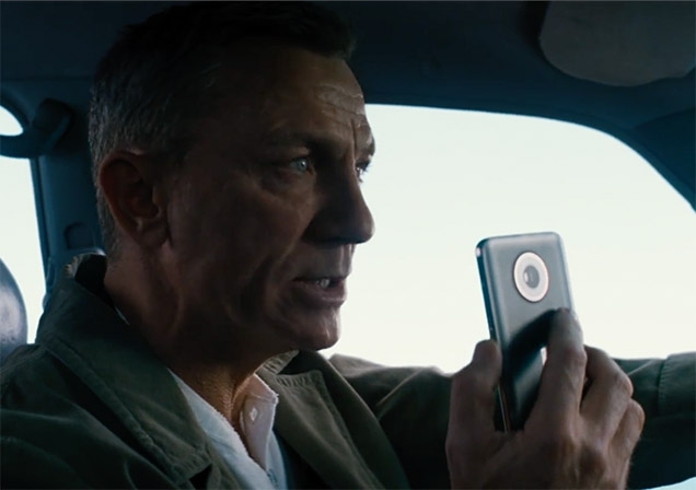 Daniel Craig as James Bond using the Nokia phone in No Time To Die while driving the Toyota Land Cruiser 90 Series.