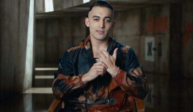 Primo (played Dali Benssalah) wears a Paul Smith hoodie jacket in No Time To Die - pictured here during a behind-the-scenes interview