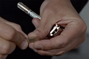 Close-up when Sean Connery as James Bond takes out the tracking device out of the Gillette Slim Razor in the movie Goldfinger.