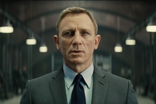 Bond wears the Tom For grey pin stripe suit in Q's lab