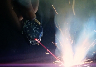 James Bond uses a laser gadget, hidden in the top bezel lume pip to escape from a train