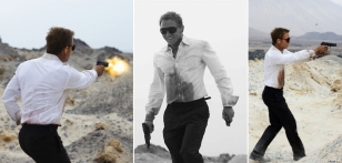 The SIG Sauer P226 is also seen in behind-the-scenes photos of Daniel Craig test firing the handgun while on location and in costume.