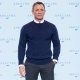 Daniel Craig wears N.Peal sweater, vintage Omega watch and Crockett & Jones shoes at the Bond 24 press conference